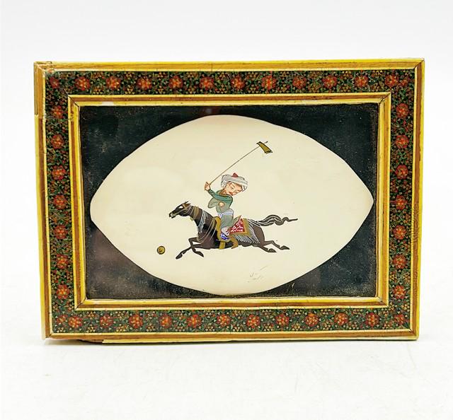 Turkish man polo player riding horse hitting ball. (1 of 5)