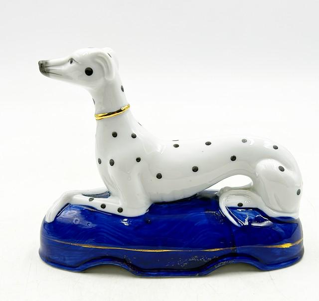 Classic vintage Dalmatian dog sitting on oval blue base. (1 of 1)