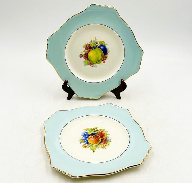 Pair of Royal Winton England stamped dinner plates.: Pair of Royal Winton England stamped dinner plates. 9.5Ó dia square style design with light blue border.
