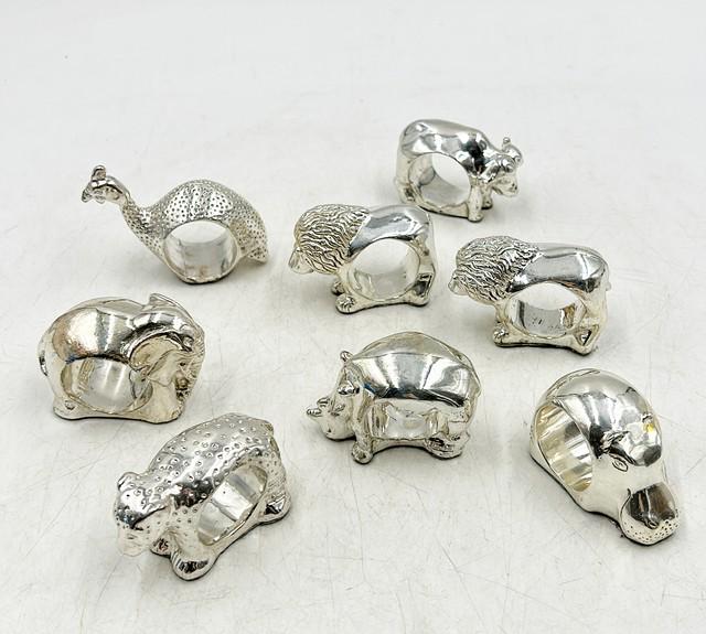 Set of 8 sterling silver stamped African style animal figure napkin rings all stamped. (1 of 7)
