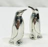 Sterling silver penguin salt & pepper shakers.