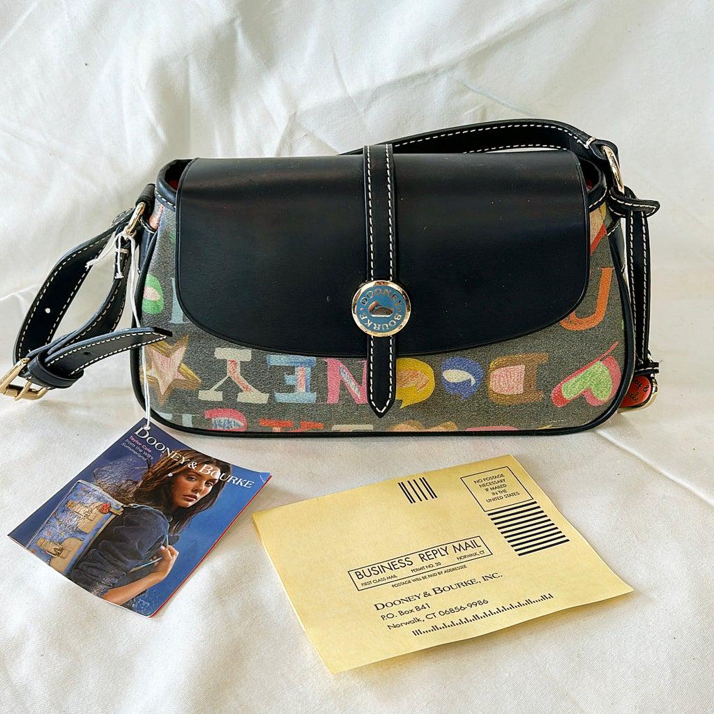 Vintage Never used Dooney & Bourke: Vintage Never used Dooney & Bourke ÒIt bagsÓ rainbow colors out of their signature. Trademark leather - weather treated cotton leather trim. Blue sky lining, candy colored zipper, and dude charm han