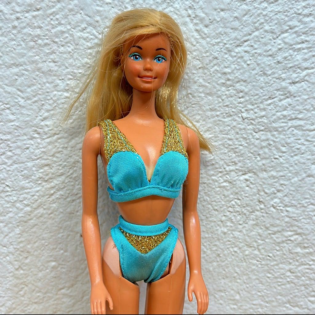 Vintage 1978 Sun Lovin Malibu Barbie -: Vintage 1978 Sun Lovin Malibu Barbie - stamped Philippines. She is wearing a 2 piece blue with gold accents anything suit with Barbie pink labels from a newer Barbie - swim suit from 1996 Mattel Barbi
