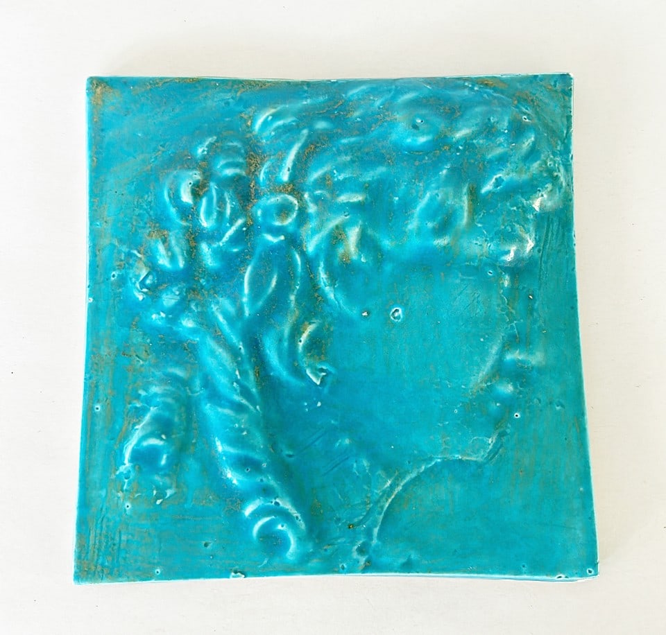 Turquoise colored glazed art nouveau tile. (1 of 3)