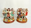 Large scale stamped Fitz & Floyd twelve days of Christmas pillar style candleholders.