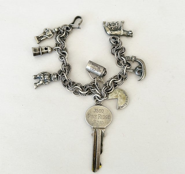 Vintage charm silver bracelet stamped 800 silver markings.: Vintage charm silver bracelet stamped 800 silver markings. Ireland and Switzerland themed charms. App ER us 7.25 long fully open.