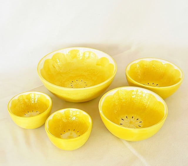 Lot set of 5 yellow lemon style mixing bowls.: Lot set of 5 yellow lemon style mixing bowls. Ceramic painted finish. 1 Large approx 3.25 tall x 8 dia. 2 medium 2.5 tall x 5.75 dia and 2 small 2.25 tall x 3.75 dia.