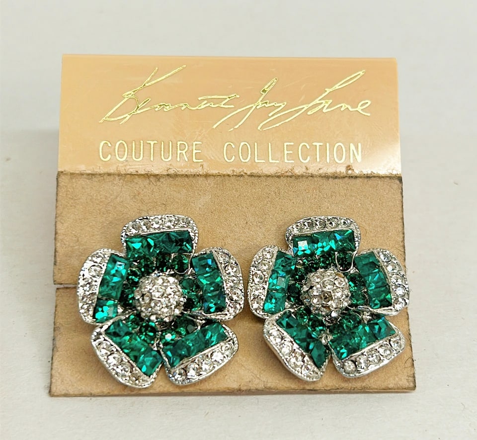 Vintage signed KJL Kenneth Jay Lane couture collection clip on earrings.: Vintage signed KJL Kenneth Jay Lane couture collection clip on earrings. Green & clear crystal flower design.