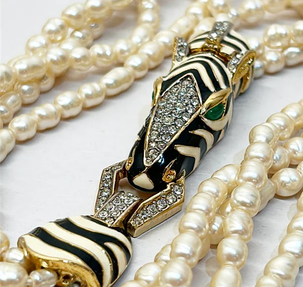 Rare vintage signed CINER faux fresh water style pearl necklace with metal zebra statement clasp.: Rare vintage signed CINER faux fresh water style pearl necklace with metal zebra statement clasp. Signed on back of clasp. 3 very long strand of faux pearls. Long enough to wear long or double up. Zeb