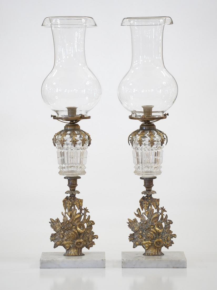 Pair of French Hurricane Lamps: A Pair of French lamps on Carerra marble bases with pressed glass containers and mouth-blown hurricane shades. Converted from whale oil to candles. Owned by Jeremiah Caldwell, a relative of Mark Twain