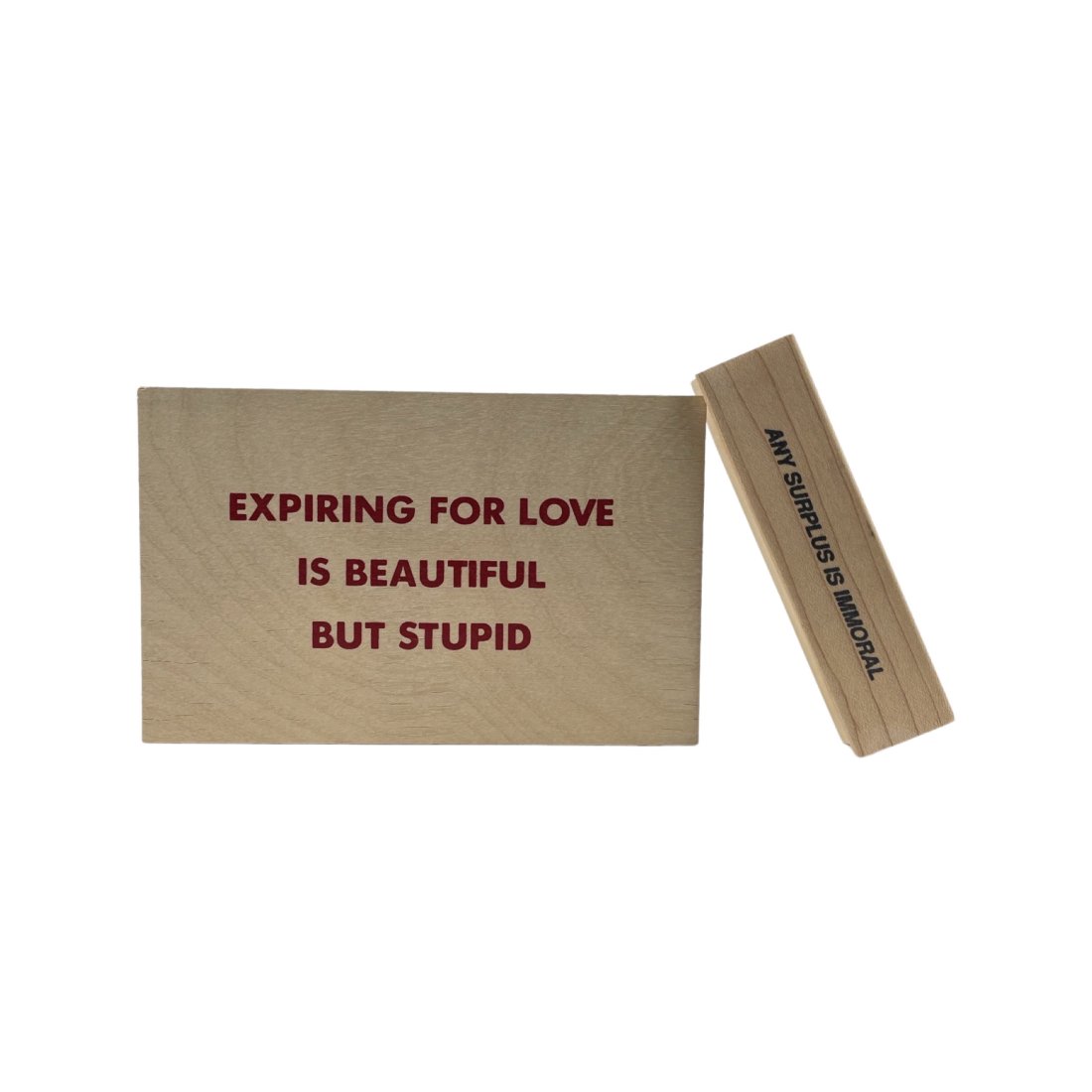 [ARTIST MULTIPLE] JENNY HOLZER. 2 TRUISMS ITEMS.: [ARTIST MULTIPLE] JENNY HOLZER. 2 TRUISMS ITEMS. TRUISMS: ANY SURPLUS IS IMMORAL. Published by Walker Art Center, Minneapolis, 1991 Rubberstamp with mixed media wood base and screenprint on wood: 3 x