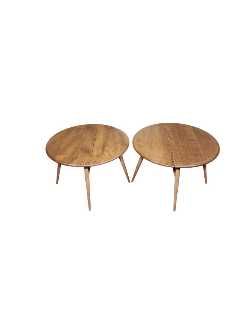 Ercol Mid Century pair of Drop Leaf Coffee Tables: Rare pair of Mid Century Modern Ercol drop leaf coffee tables in excellent condition.Open dimensions 24 inches around x 16 inches high