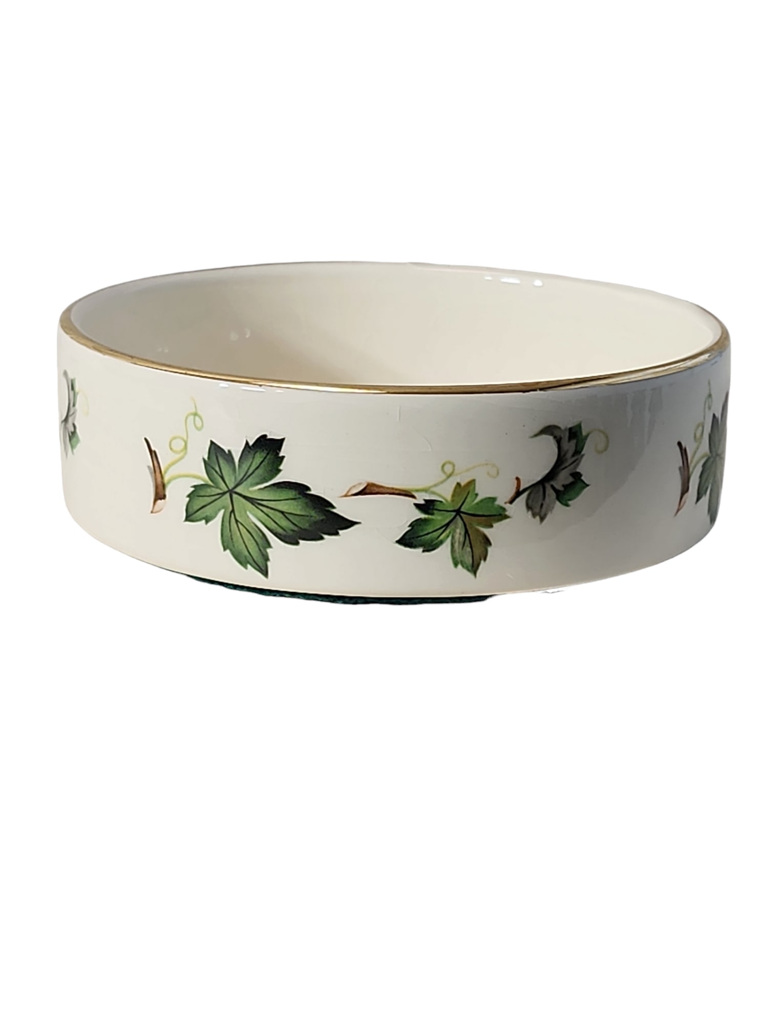 1960s Prinknash Abbey Wine Bottle Coaster: Lovely 1960s wine bottle coaster from Prinknash Abbey in England in excellent condition. Keep bottle drips off your table, magic vine quote to the interior with grape leaves and vines, lovely gift for