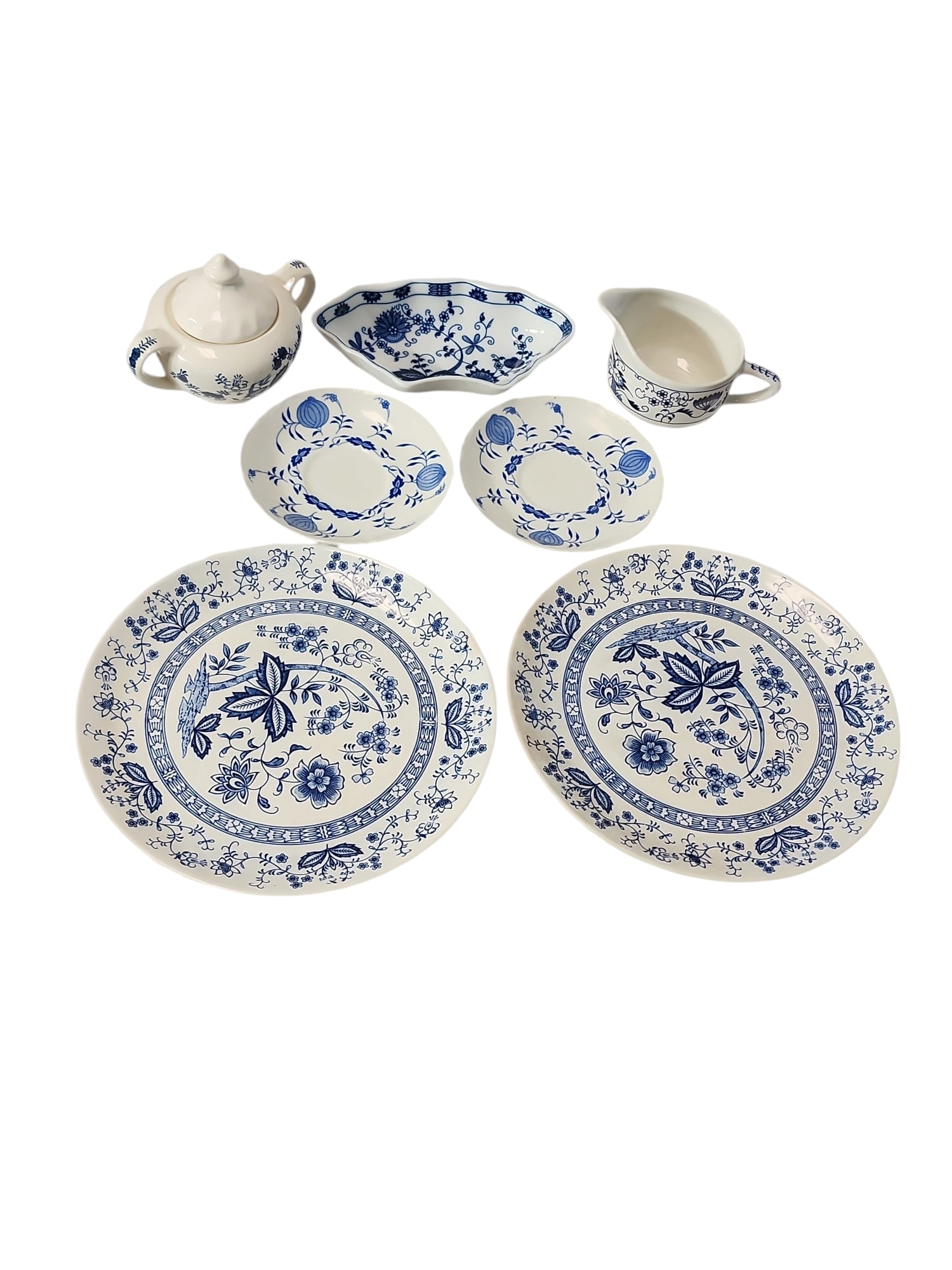 Blue Onion Pattern Collection - 7 Pieces: Nice collection of Blue Onion serveware, seven pieces total, some Japan origin, some American.Blue Onion Japan teapot - 6 x 4 x 5 inchesVienna Woods nut tray - 7.5 x 4 x 1.5 inchesCreamer - 5.5 x 3.5