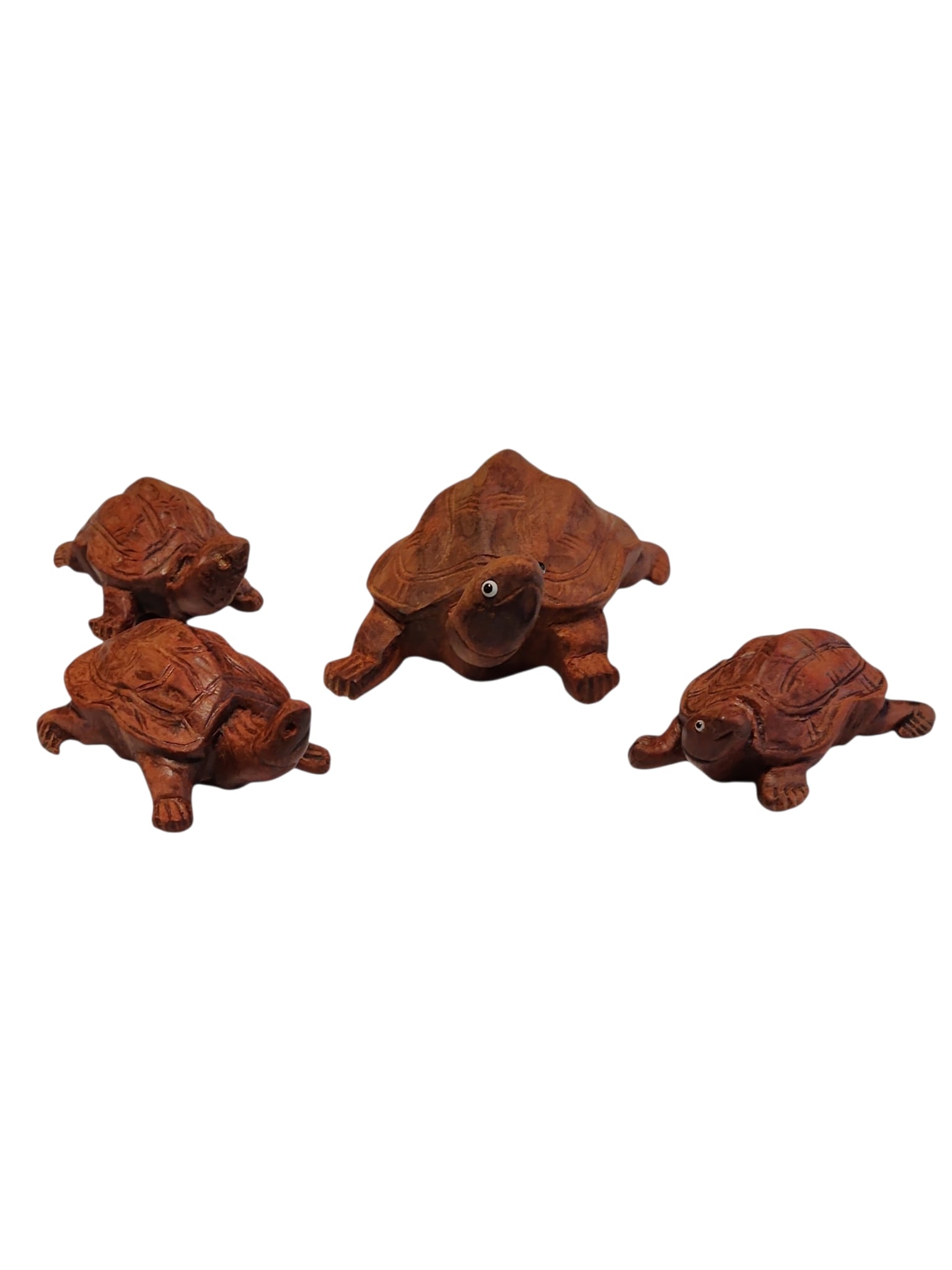 Vintage Set Balinese Hand Carved Turtles - Four Pieces: Vintage four piece set of Balinese hand carved wooden turtles, all in excellent condition.Large turtle measures 4 x 2.5 x 1.5 inches, smaller each measure 2.5 x 1.5 x 1 inches.