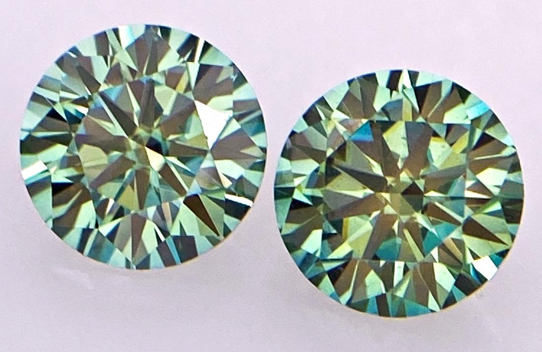 1.88 Carat Green Moissanite: 1.88 Carat Green Moissanite Shape - Round Brilliant Color - Green Transparency - TransparentDimensions - 6.5 mm Good quality with luster. Perfectly suited as an investment, collector's item or for use