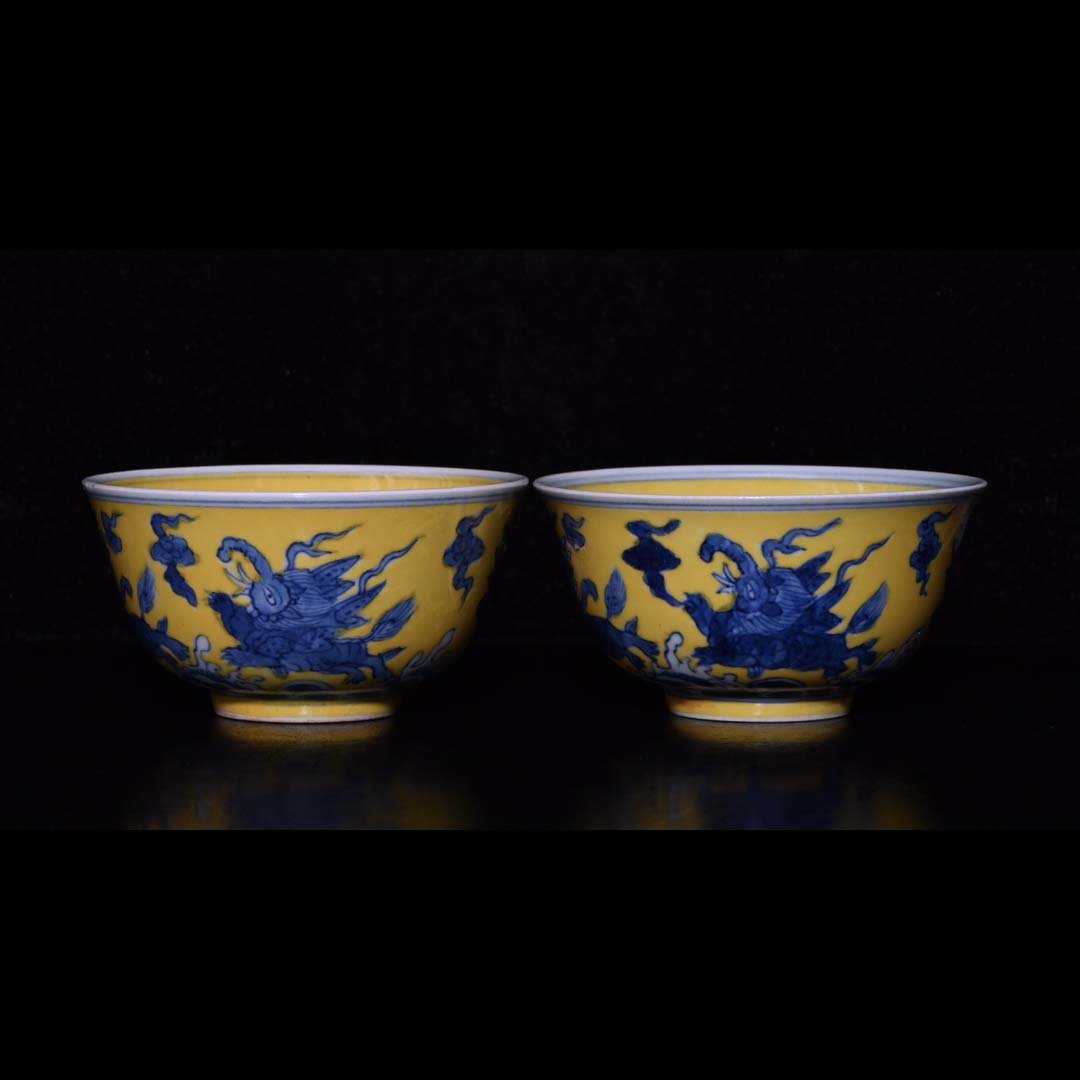 A pair of Ming Chenghua yellow glazed blue and white walrus cups (1 of 9)