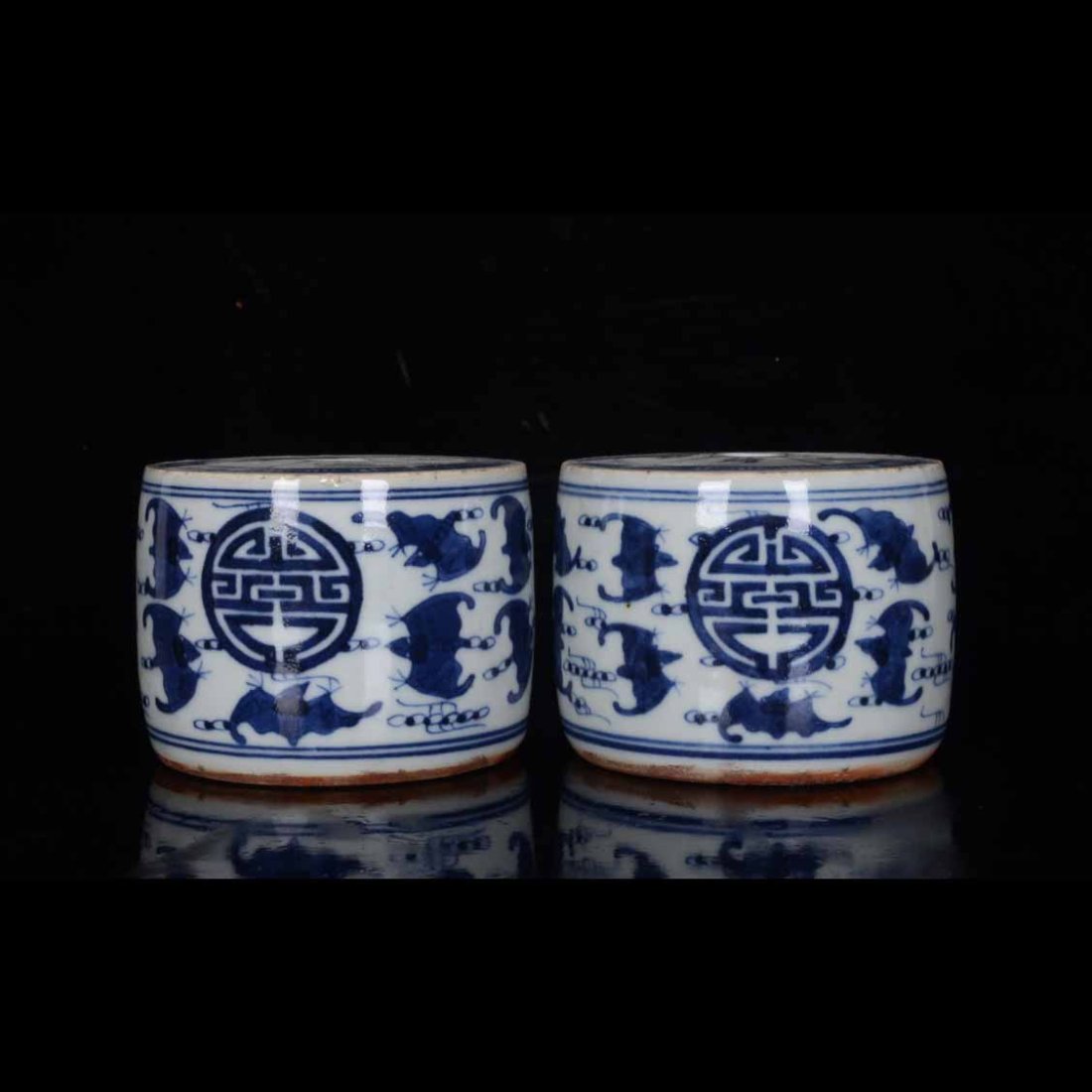 A pair of Qing Dynasty blue and white candlesticks with five blessings and longevity patterns (1 of 9)