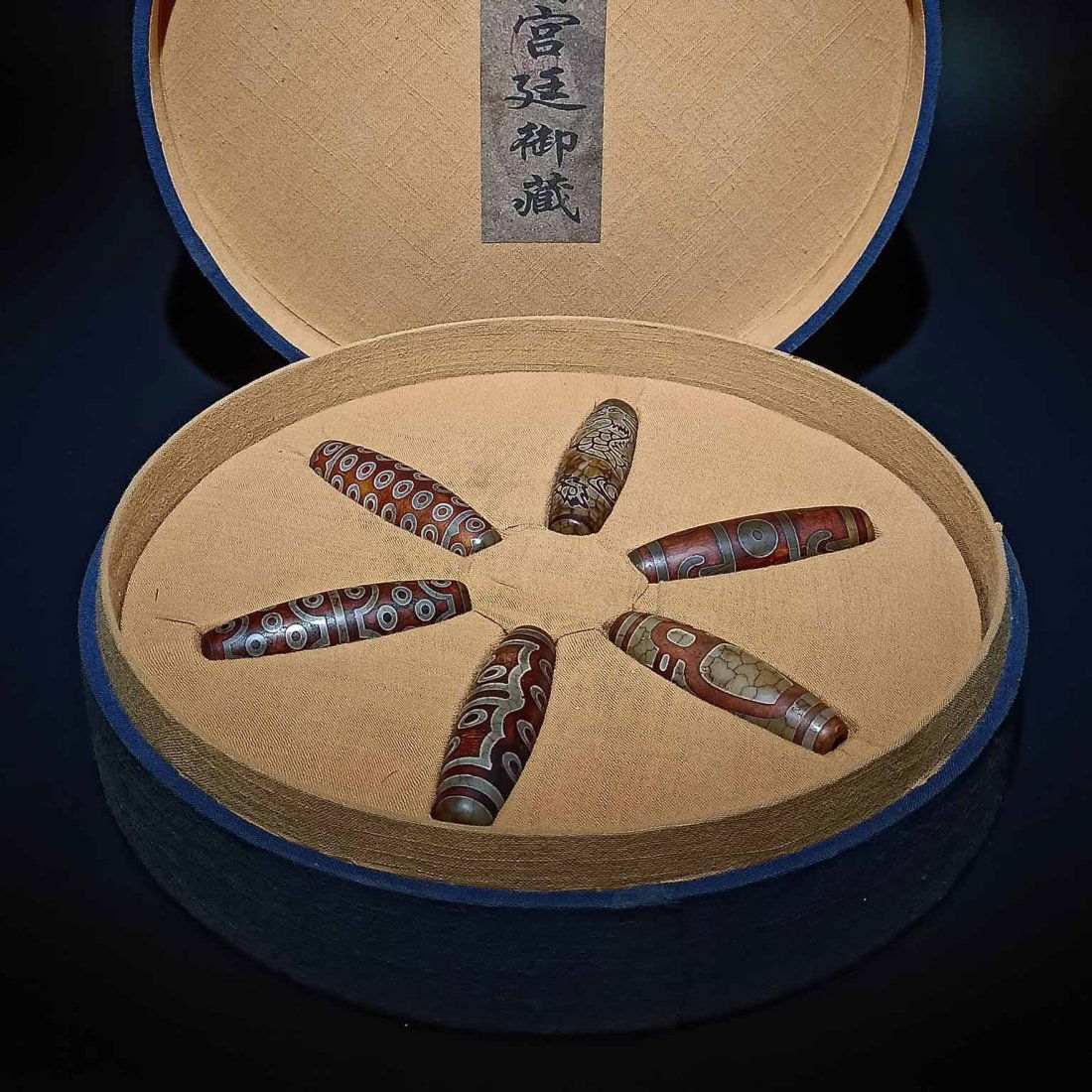 A box of old Dzi beads from the Qing court’s imperial collection (1 of 10)