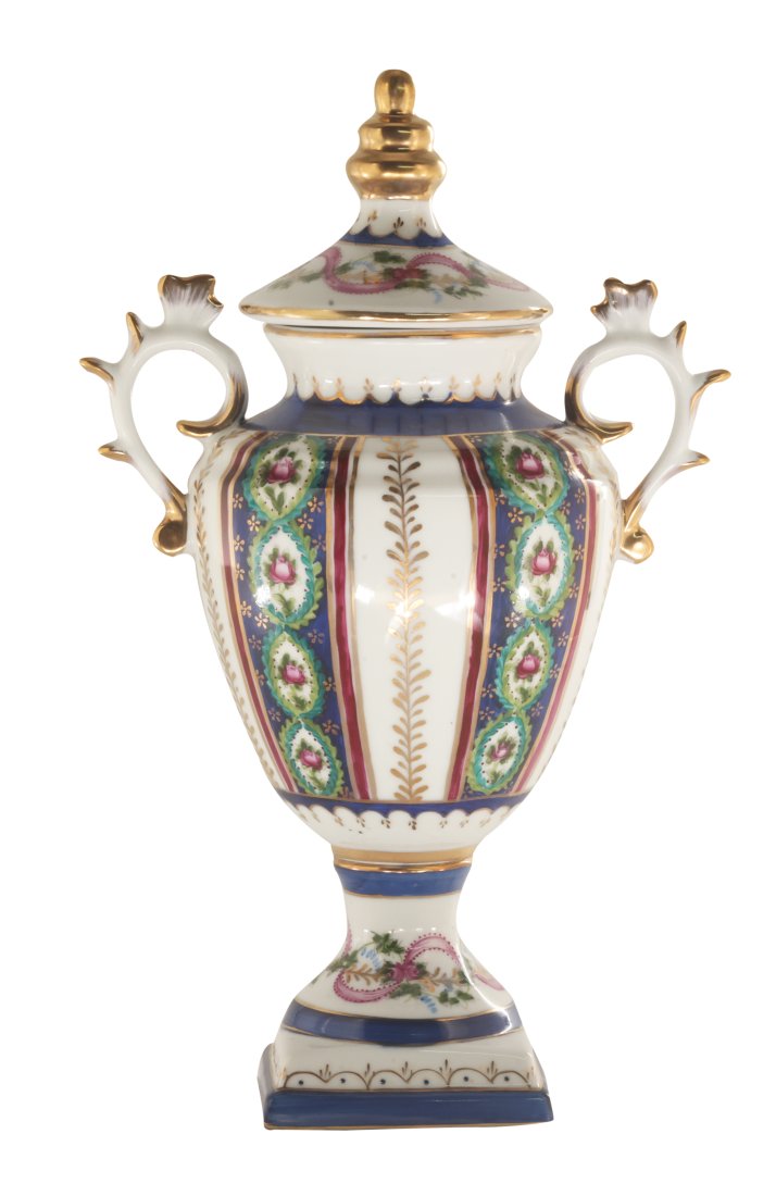 Floral Porcelain Vase: Up for auction is a beautiful porcelain vase with lid. The bowl sits on an ornate square base and is completely hand painted. The blue color of the jar is striking and elegant, creating a vivid backdr