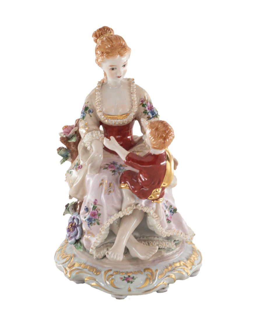 Mother and Son Porcelain Figurine: Up for auction is a hand painted porcelain figure depicting a mother and son. Created in a classic Rococo style, this figurine is brand new and stands 8.5 inches in height by 8 inches in width.