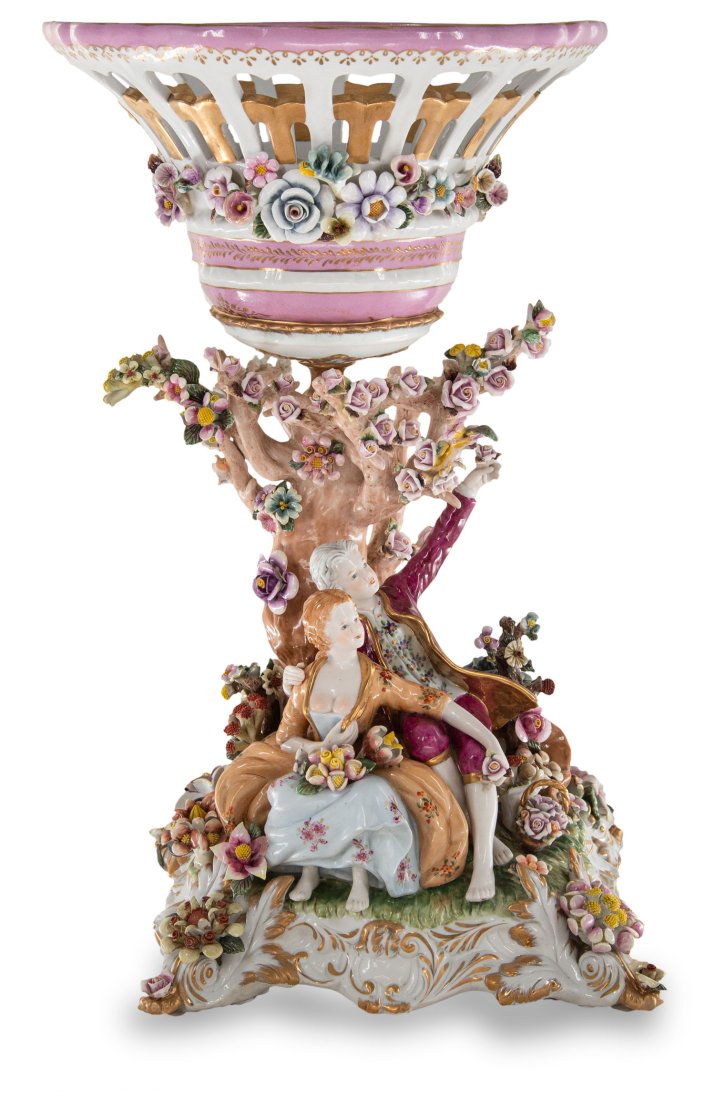 Hand Painted Rococo Style Porcelain Bowl With Figurines: Up for auction is an exceptional porcelain bowl. The bowlâ€™s body sits on top of an incredibly intricate Rococo style scene incorporating porcelain figures set against nature. The pink color of 