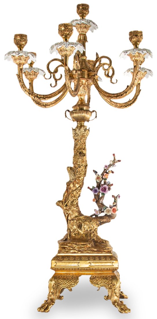 Bronze and Porcelain Seven Cup Candle Holder: Up for auction is an elegant bronze and porcelain candle holder. Every detail in this piece has been thoughtfully designed from the claw foot base to the natural stem. The piece incorporates seven cup