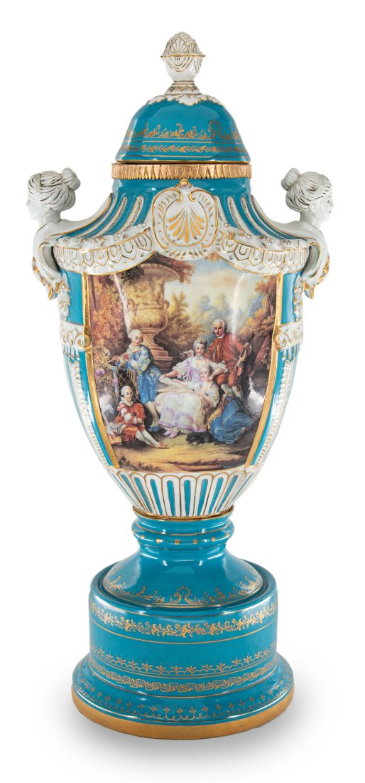 Hand Painted Rococo Style Porcelain Vase: Up for auction is an exceptional porcelain vase. The vaseâ€™s body sits on top of a flared stem, and a circular base. This piece is highlighted by the incredibly detailed handles exemplifying fem