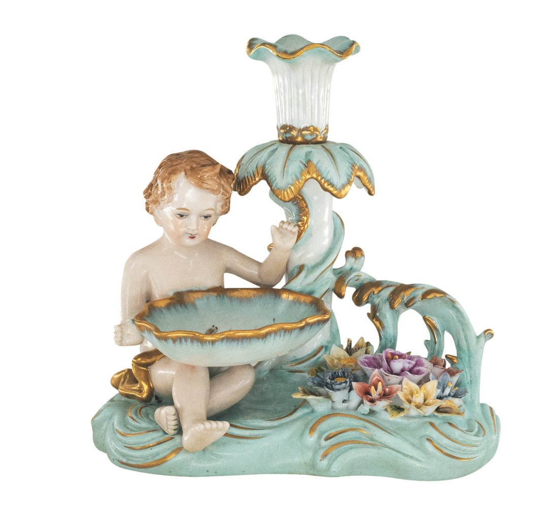 Porcelain Cherub Candle Holder: Up for auction is a hand painted porcelain candle holder. Created in a classic Rococo style, this candle holder is brand new and stands 8 inches in height.