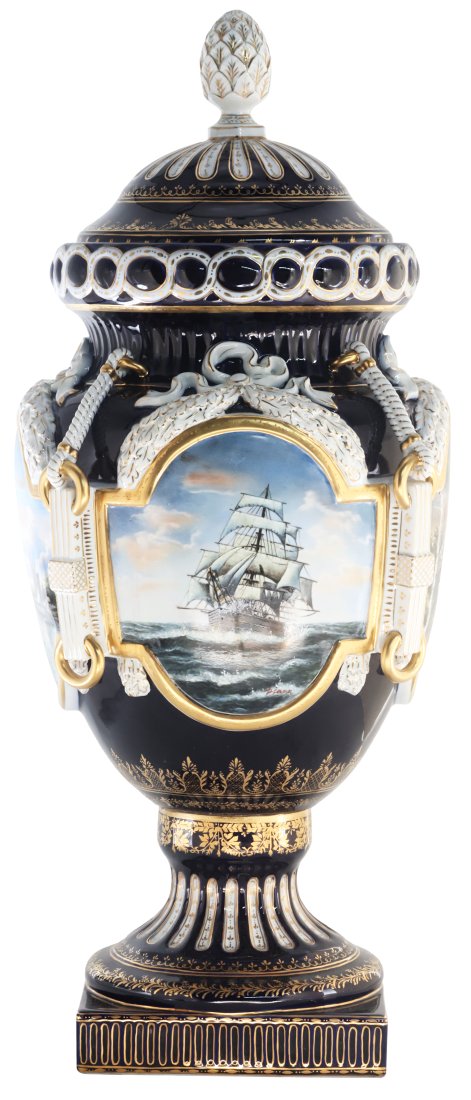Nautical Porcelain Vase: Up for auction is an exceptional porcelain vase. The vaseâ€™s body sits on top of a flared stem, and a square base. This piece is highlighted by the incredibly detailed ring handles. The dark col