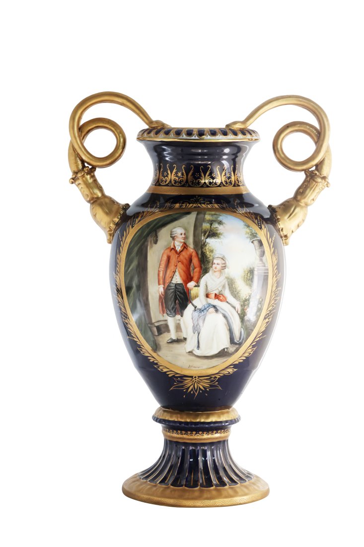 Snake Handle Porcelain Jar: Up for auction is an exceptional porcelain vase. The vaseâ€™s body sits on top of a flared stem, and a circular base. This piece is highlighted by the incredibly detailed snake handles. The dark 