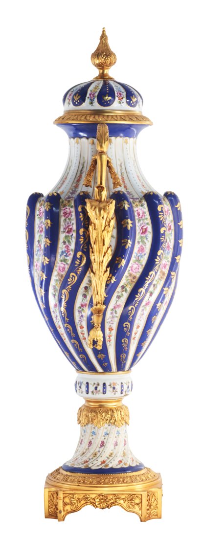 Twisted Porcelain and Bronze Vase: Up for auction is an exceptional porcelain lidded vase. The vaseâ€™s body sits on top of a flared stem, and an ornate square bronze base. This piece is highlighted by the incredibly detailed bron