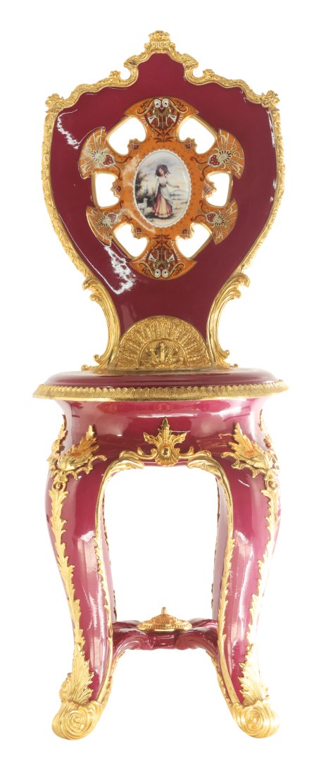 Stunning Hand Painted Red Porcelain and Bronze Chair: Up for auction is an incredibly unique porcelain chair. The entire chair is composed of porcelain and painted by hand. The backboard and seat incorporate full paintings depicting classical Rococo scen