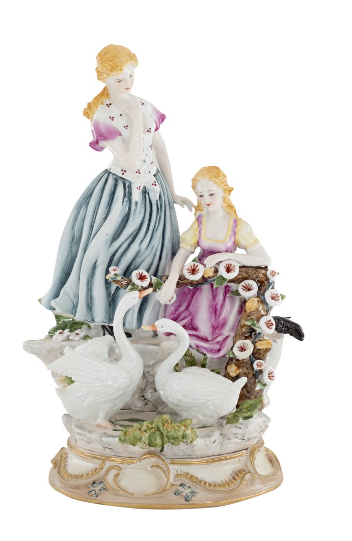 Feeding the Swans Porcelain Figurine: Up for auction is a hand painted porcelain figure depicting two woman feeding swans. Created in a classic Rococo style, this figurine is brand new and stands 14 inches in height.