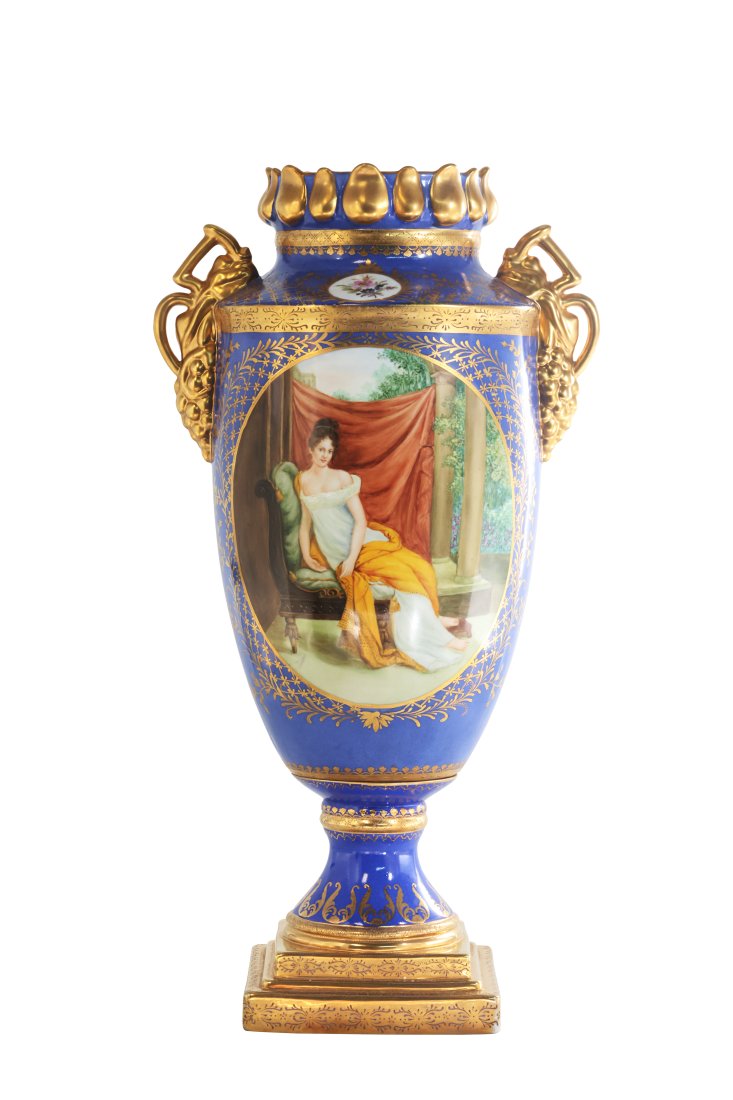 Grape Handle Portrait Vase: Up for auction is a beautiful porcelain vase. The vaseâ€™s body sits on top of a flared stem, and square base. The piece is highlighted by the incredibly detailed grape handles. The blue color of