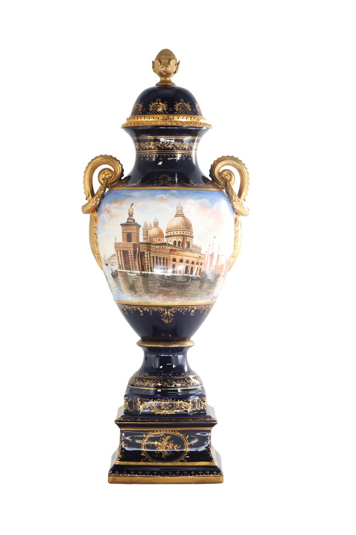 Venetian Porcelain Vase: Up for auction is classic porcelain vase. The vaseâ€™s body sits on top of a flared stem, and a square base. This piece is highlighted by the bronze vine handles as well as the bronze elements on