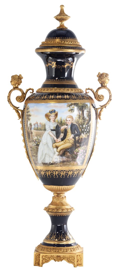 Romantic Bronze and Porcelain Vase: Up for auction is an exceptional porcelain vase. The vaseâ€™s body sits on top of a flared stem, and a bronze square base. This piece is highlighted by the incredibly detailed bronze handles exem