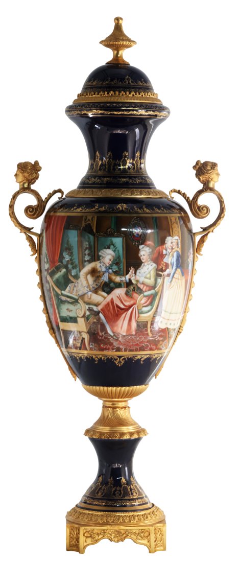 Society Bronze and Porcelain Vase: Up for auction is an exceptional porcelain vase. The vaseâ€™s body sits on top of a flared stem, and a bronze square base. This piece is highlighted by the incredibly detailed bronze handles exem