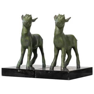 After Robert Bousquet (1888-1917) Art Deco Goat Bookends: A pair of Art Deco spelter bookends on a black marble base by the French sculptor Robert Bousquet (1888â€“1917).