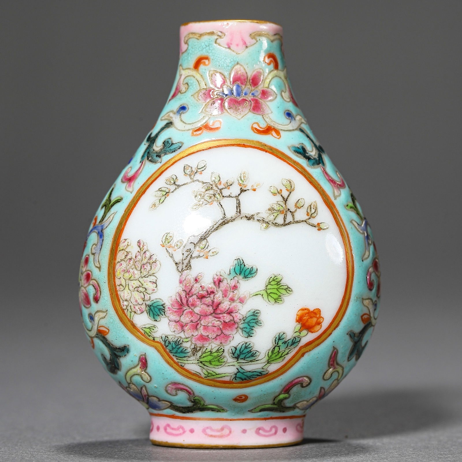 A CHINESE FAMILLE ROSE SNUFF BOTTLE WITH FLOWER AND BIRD DESIGN, MARKED "QIANLONG NIAN ZHI," (1 of 3)