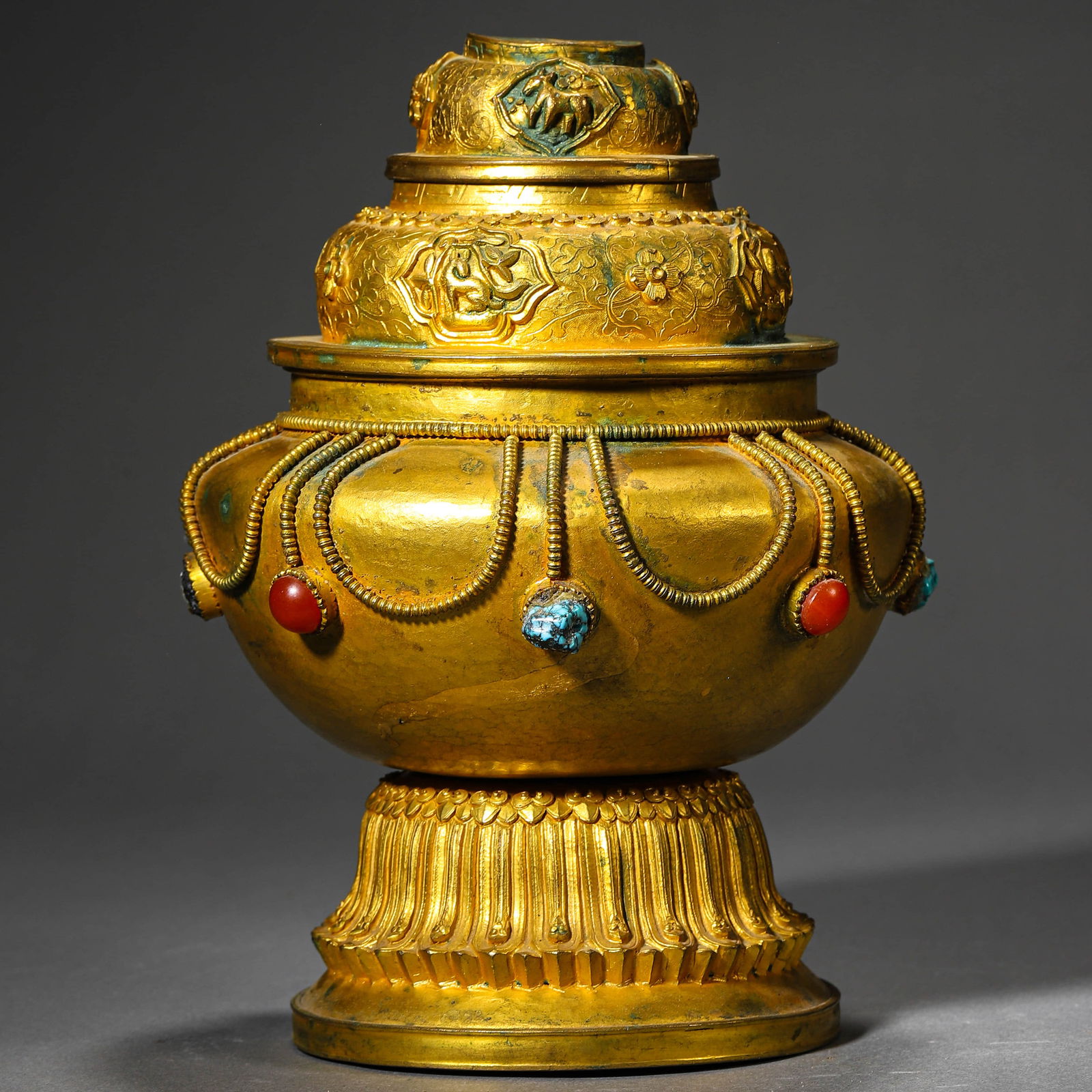 A TIBETAN GILT-BRONZE AND GEM-INLAID RICE BOX. (1 of 3)