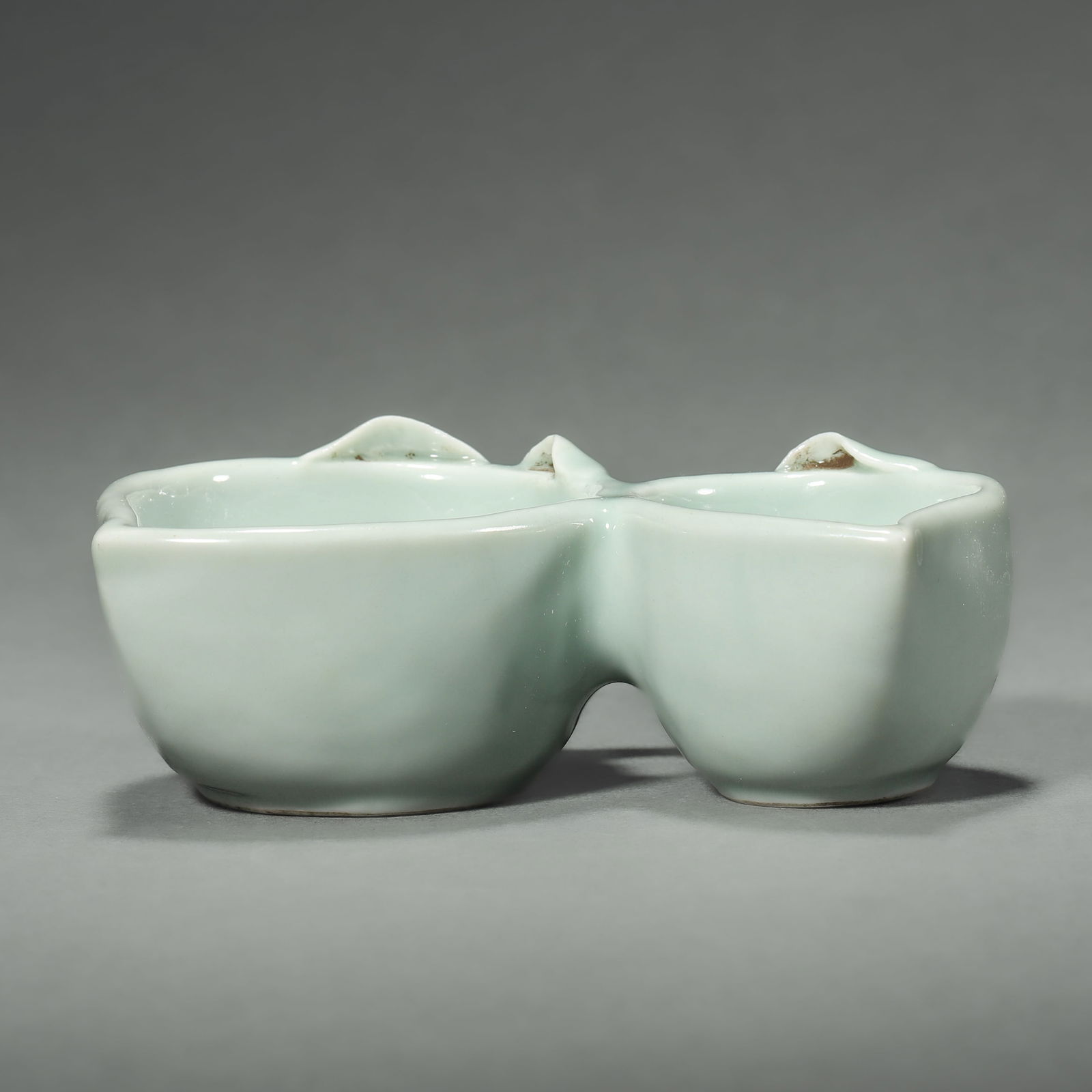 A CHINESE QING GLAZED DOUBLE-PEACH WATER DROPPER, MARKED "DA QING QIANLONG NIAN ZHI," POSSIBLY QING (1 of 4)