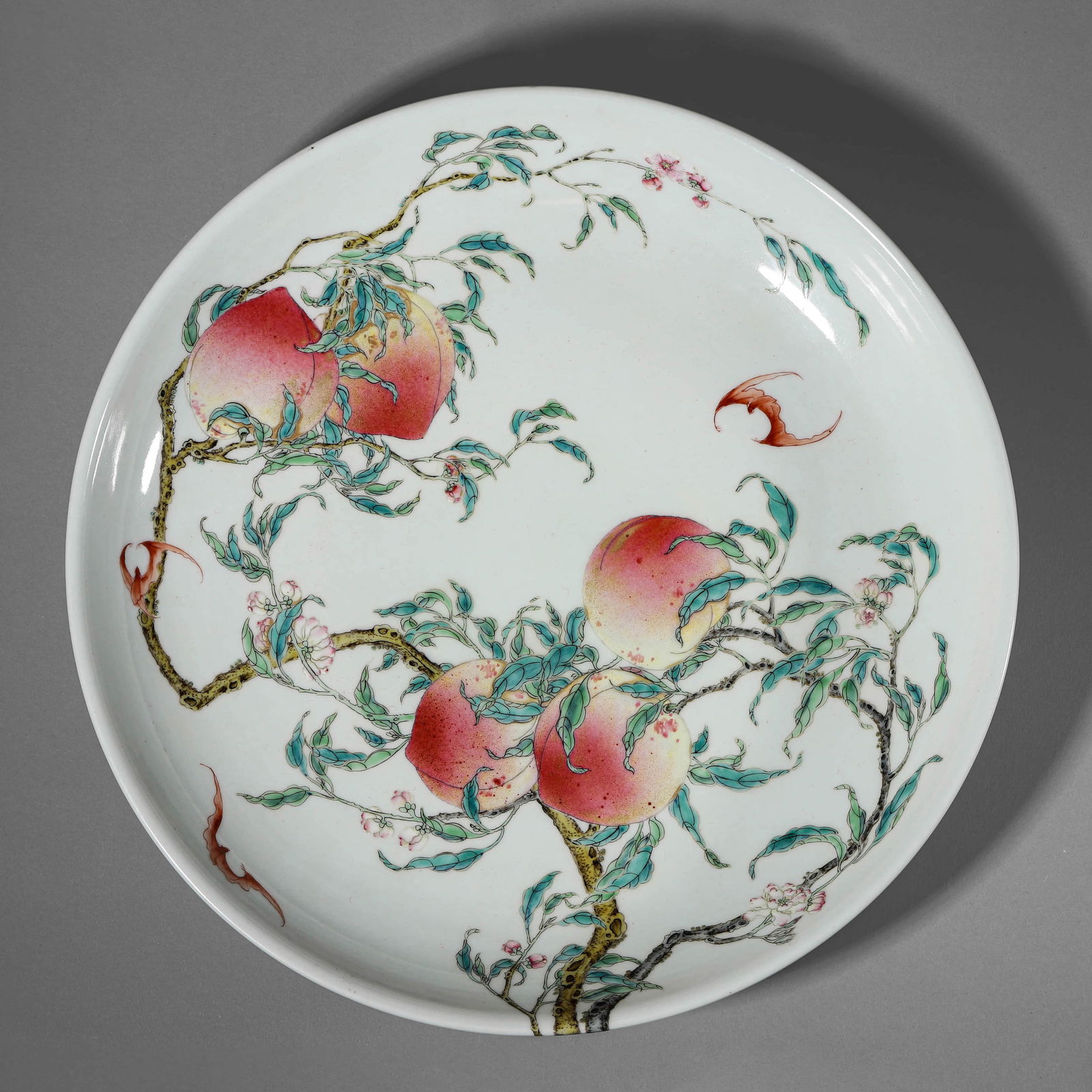 A CHINESE FAMILLE ROSE DISH WITH EIGHT PEACH MOTIFS, MARKED "DA QING YONGZHENG NIAN ZHI," POSSIBLY (1 of 2)