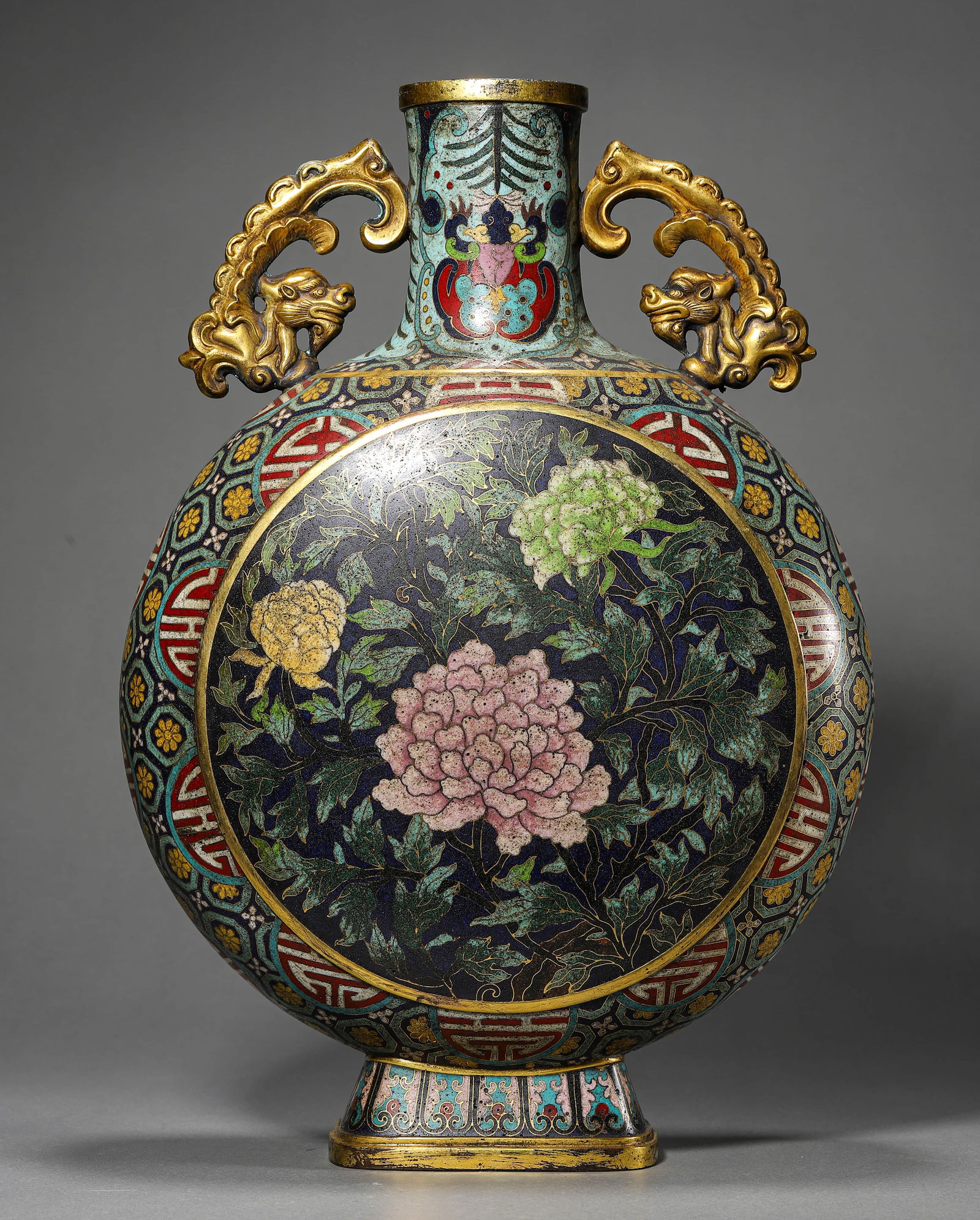 A CHINESE CLOISONNÉ ENAMEL MOON FLASK WITH FLORAL MOTIFS, MARKED "DA QING QIANLONG NIAN ZHI,": A CHINESE CLOISONNÉ ENAMEL MOON FLASK WITH FLORAL MOTIFS, MARKED "DA QING QIANLONG NIAN ZHI," POSSIBLY QING DYNASTY, 18TH CENTURY. Dimensions: Height: 14 7/8 in. (37.8 cm) ALL ITEMS SOLD AS IS, NO R