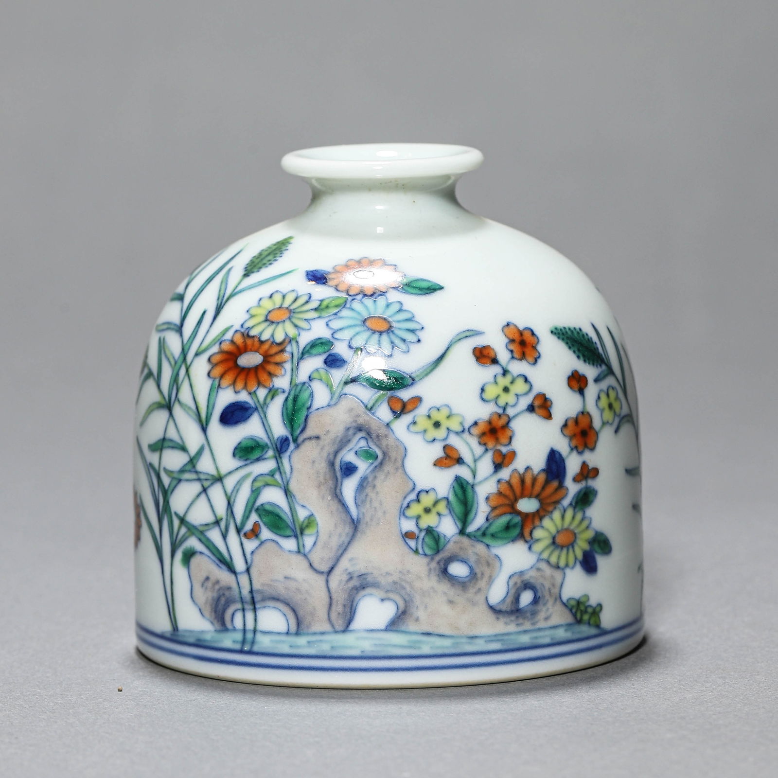 A CHINESE DOUCAI MA TI ZUN WITH FLORAL AND ROCK MOTIFS, MARKED "DA QING YONGZHENG NIAN ZHI," (1 of 4)