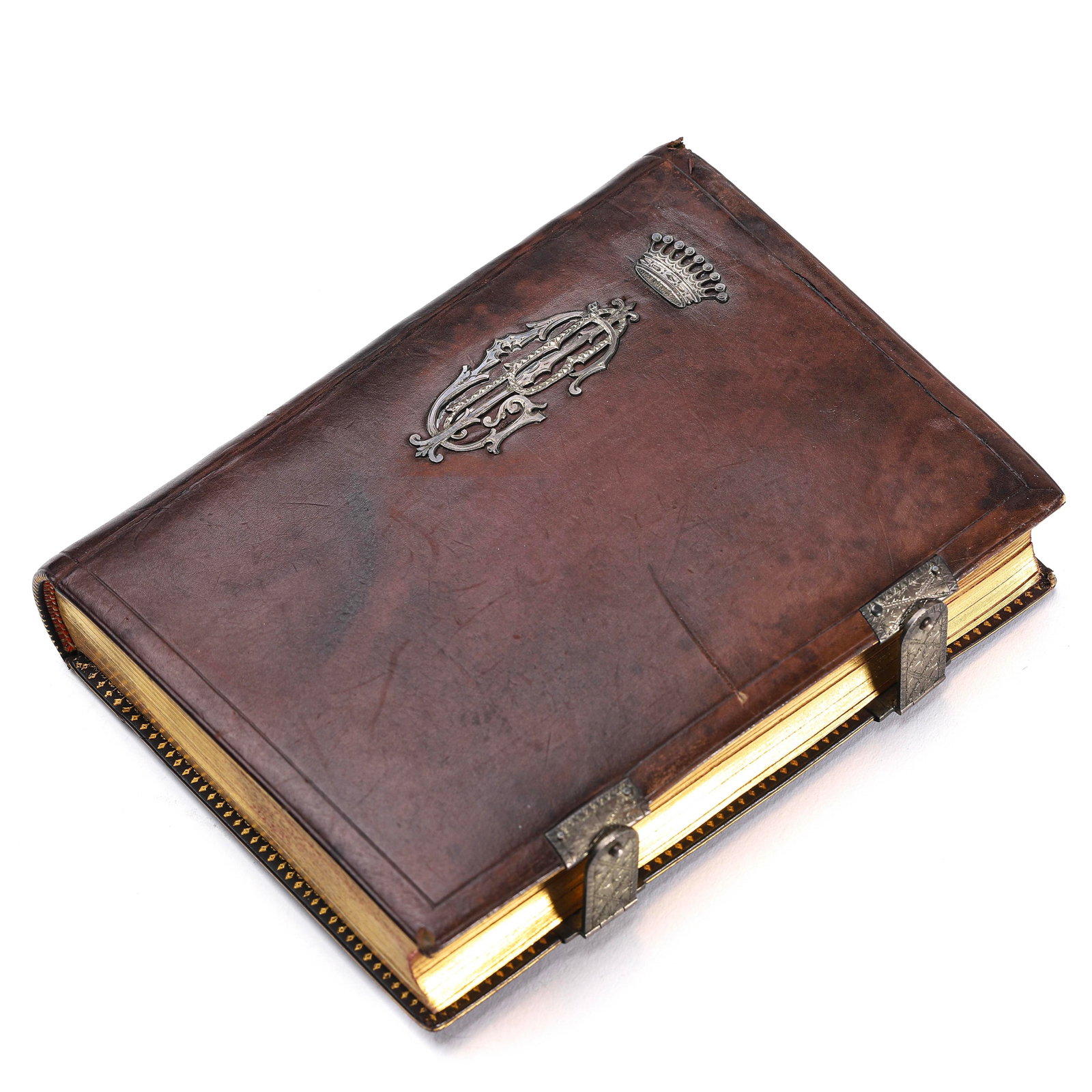 CUSTOM LEATHERBOUND SILVER COAT OF ARMS BOOK.: CUSTOM LEATHERBOUND SILVER COAT OF ARMS BOOK. Dimensions: Length: 5 7/8 in (15 cm); Width: 4 1/2 in (11.5 cm); Thickness: 1 3/16 in (3 cm) ALL ITEMS SOLD AS IS, NO RETURNS Condition: Any statement