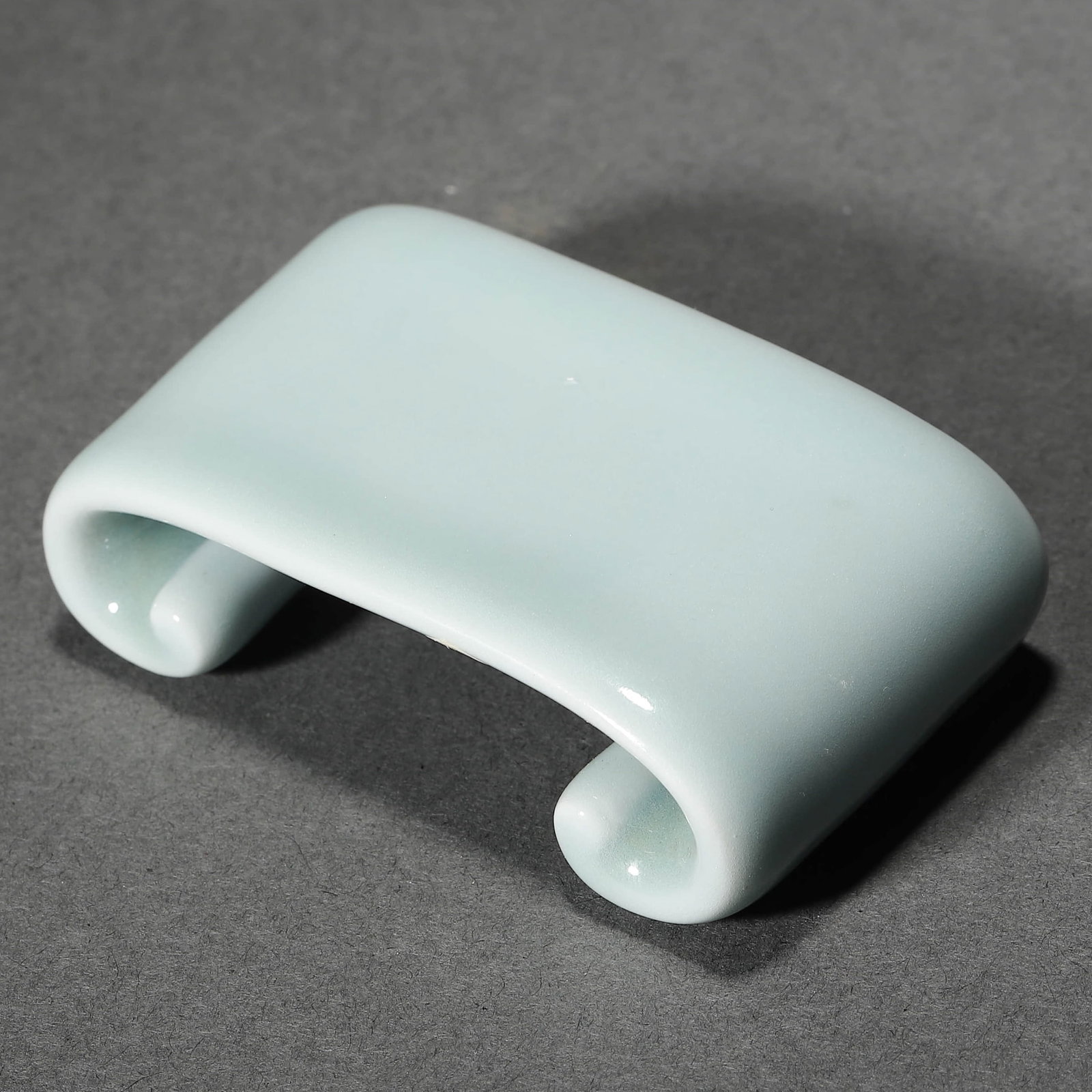 A CHINESE SKY BLUE GLAZED INKSTONE, MARKED "QIANLONG NIAN ZHI.": A CHINESE SKY BLUE GLAZED INKSTONE, MARKED "QIANLONG NIAN ZHI." Dimensions: Length: 2 15/16 in. (7.5 cm), Height: 13/16 in. (2 cm) ALL ITEMS SOLD AS IS, NO RETURNS Condition: Any statement made in