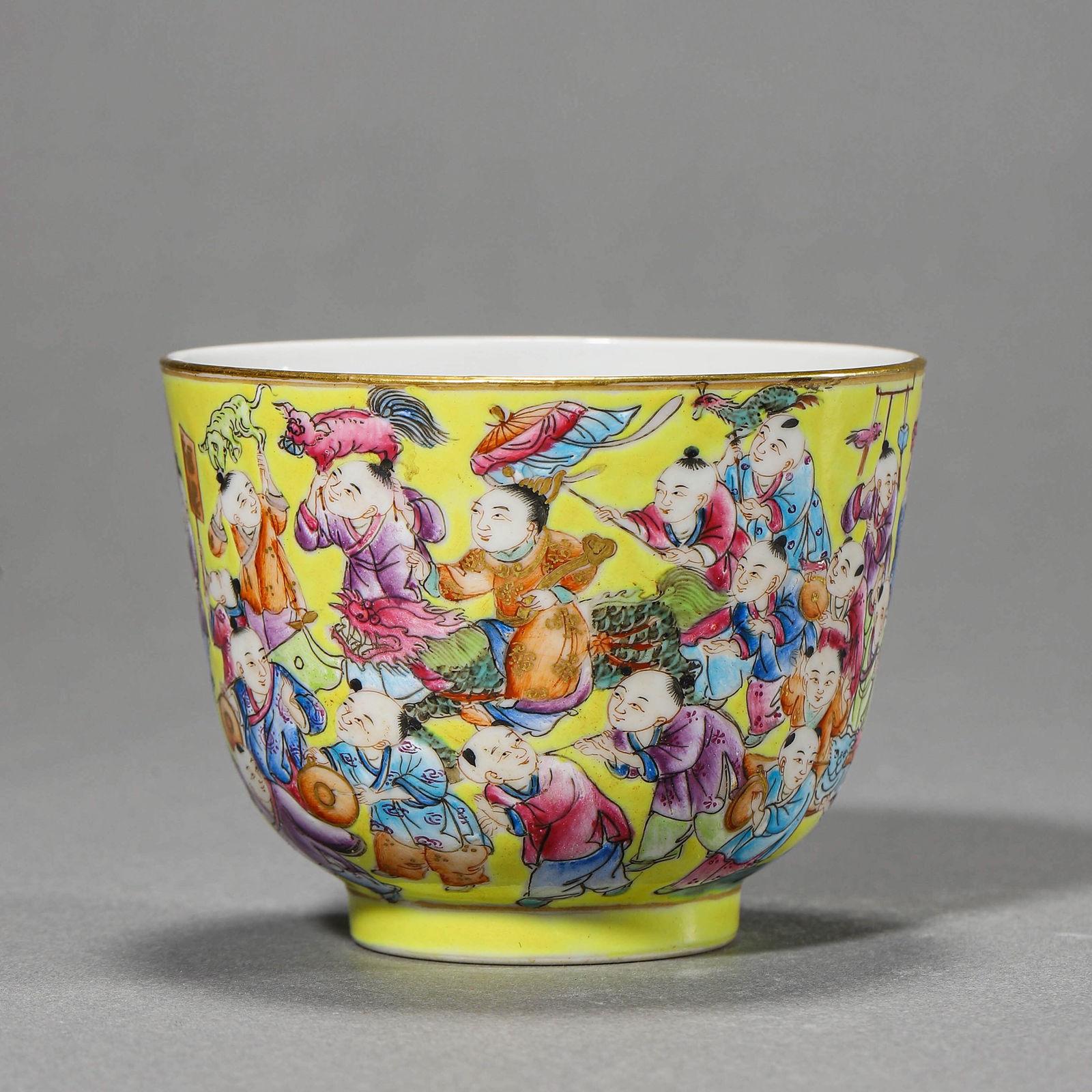 A CHINESE FAMILLE ROSE CUP WITH CHILDREN AT PLAY MOTIF, INSCRIBED "JI XIANG RU YI" (1 of 3)