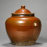 A CHINESE RUST-GLAZED JAR.