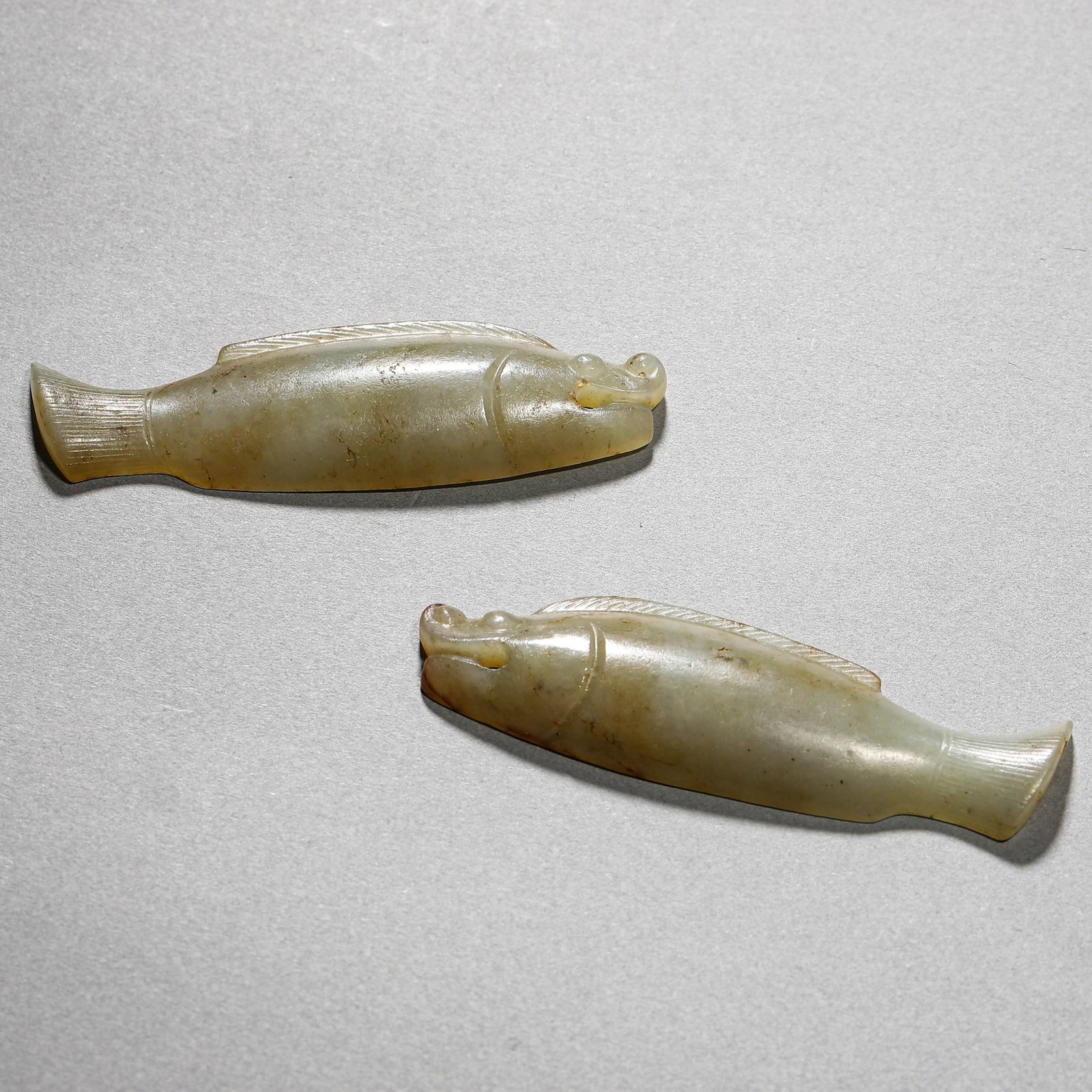 A CHINESE DOUBLE FISH TALISMAN: A CHINESE DOUBLE FISH TALISMAN Dimensions: Length: 2 3/4 in. (7 cm) ALL ITEMS SOLD AS IS, NO RETURNS Condition: Any statement made in any catalogue or otherwise regarding the origin, date, age, at